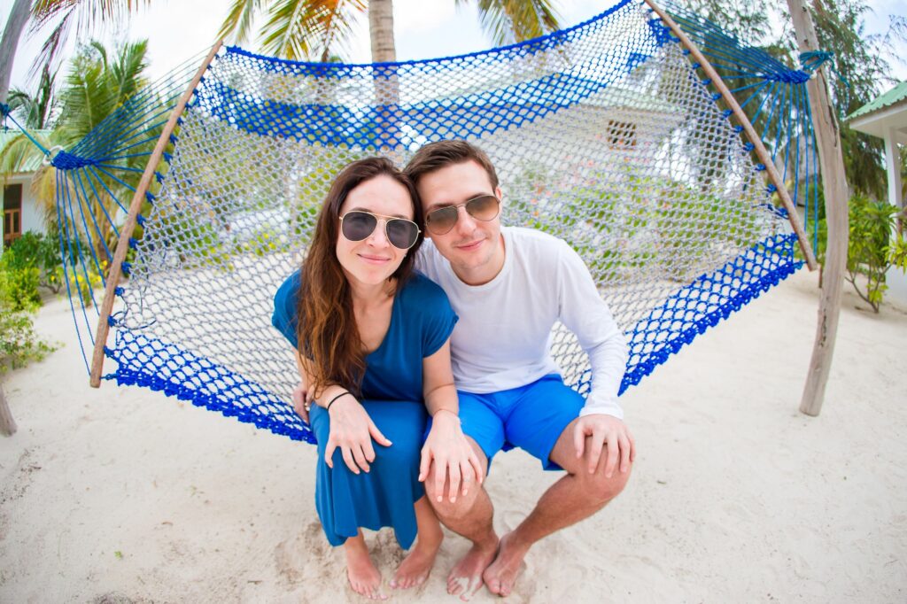 Happy Couple On The Beach In Honeymoon